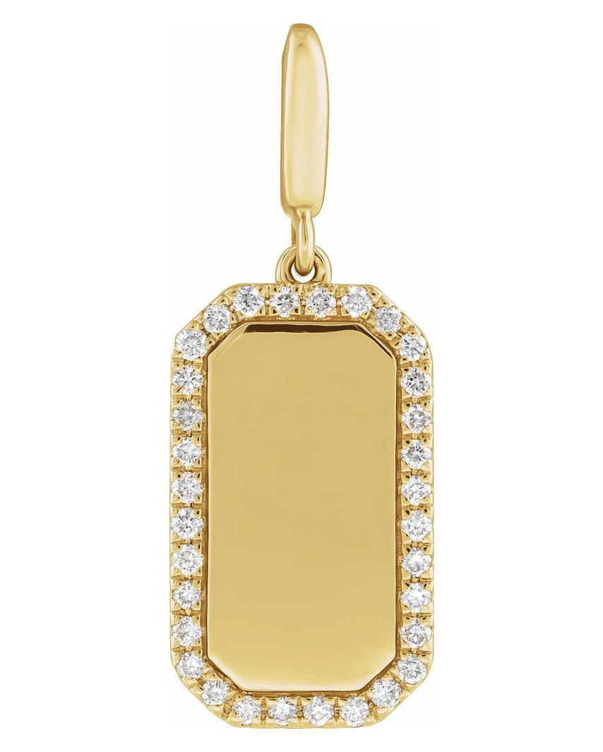 A gold rectangular pendant charm with a smooth blank center and a border of small clear stones, shown on a plain white background.