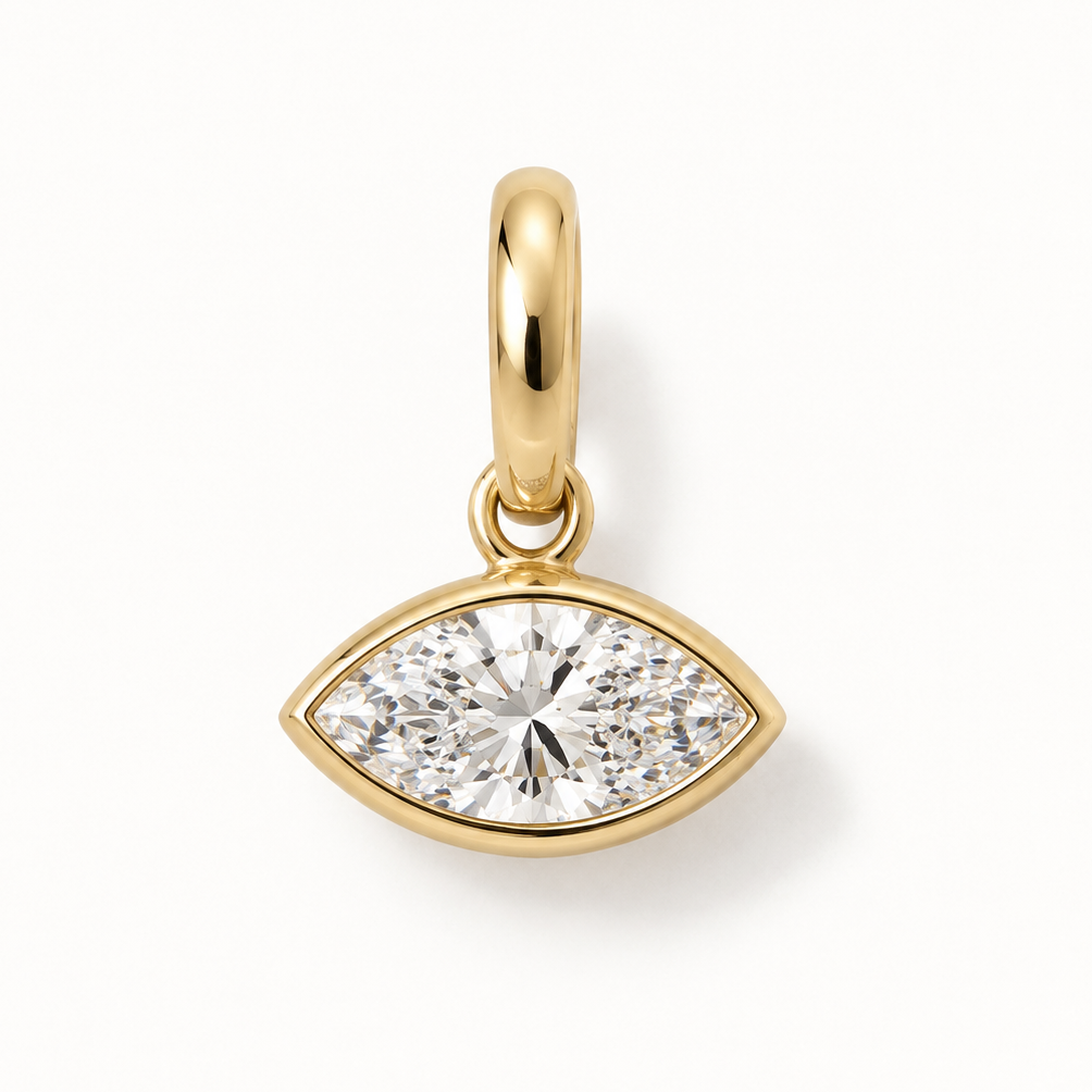 A gold marquise cut pendant charm featuring a marquise-cut clear Diamond, shown on a clean white background.