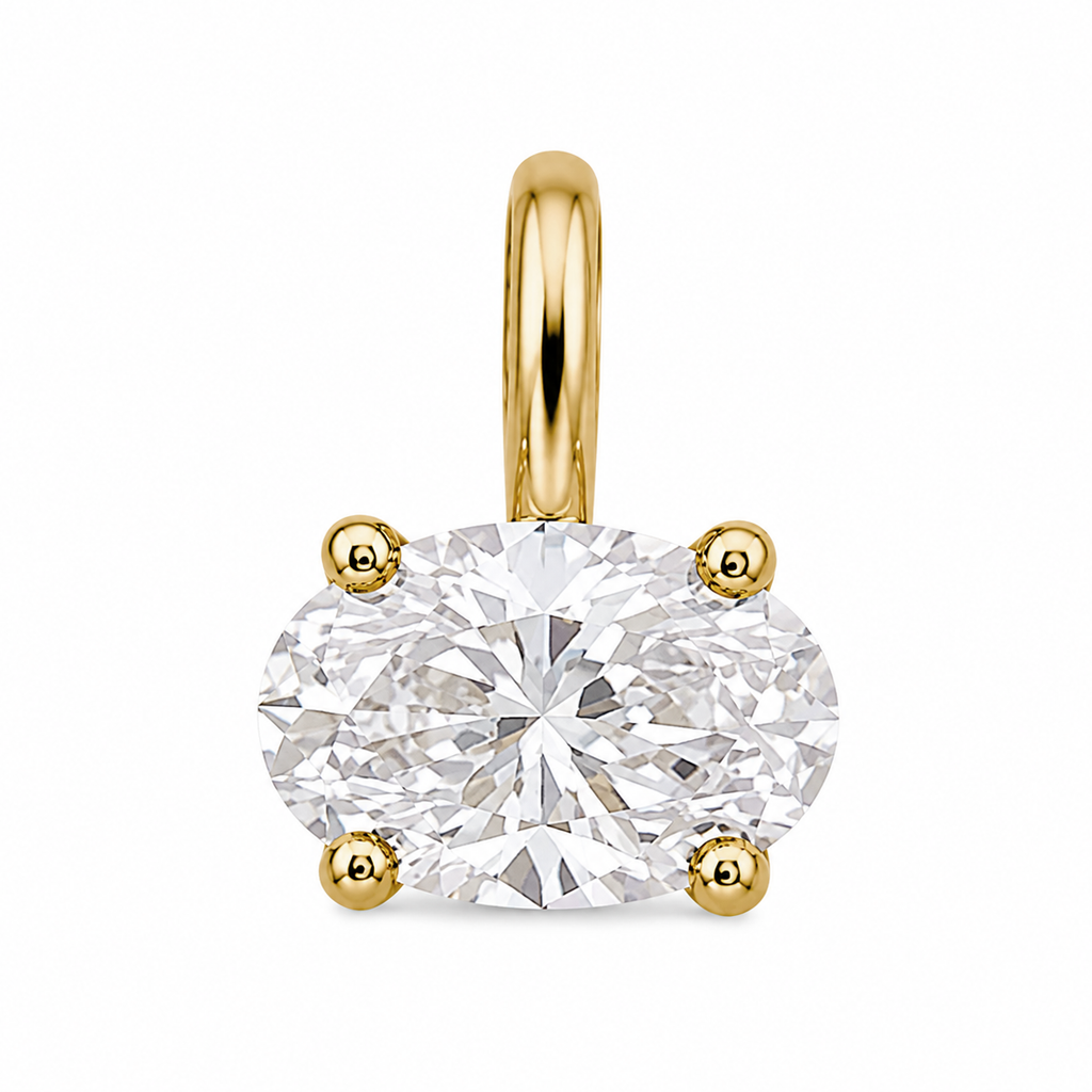 An oval-cut diamond solitaire pendant in a yellow gold four-prong setting with a matching gold bail, shown on a solid white background.